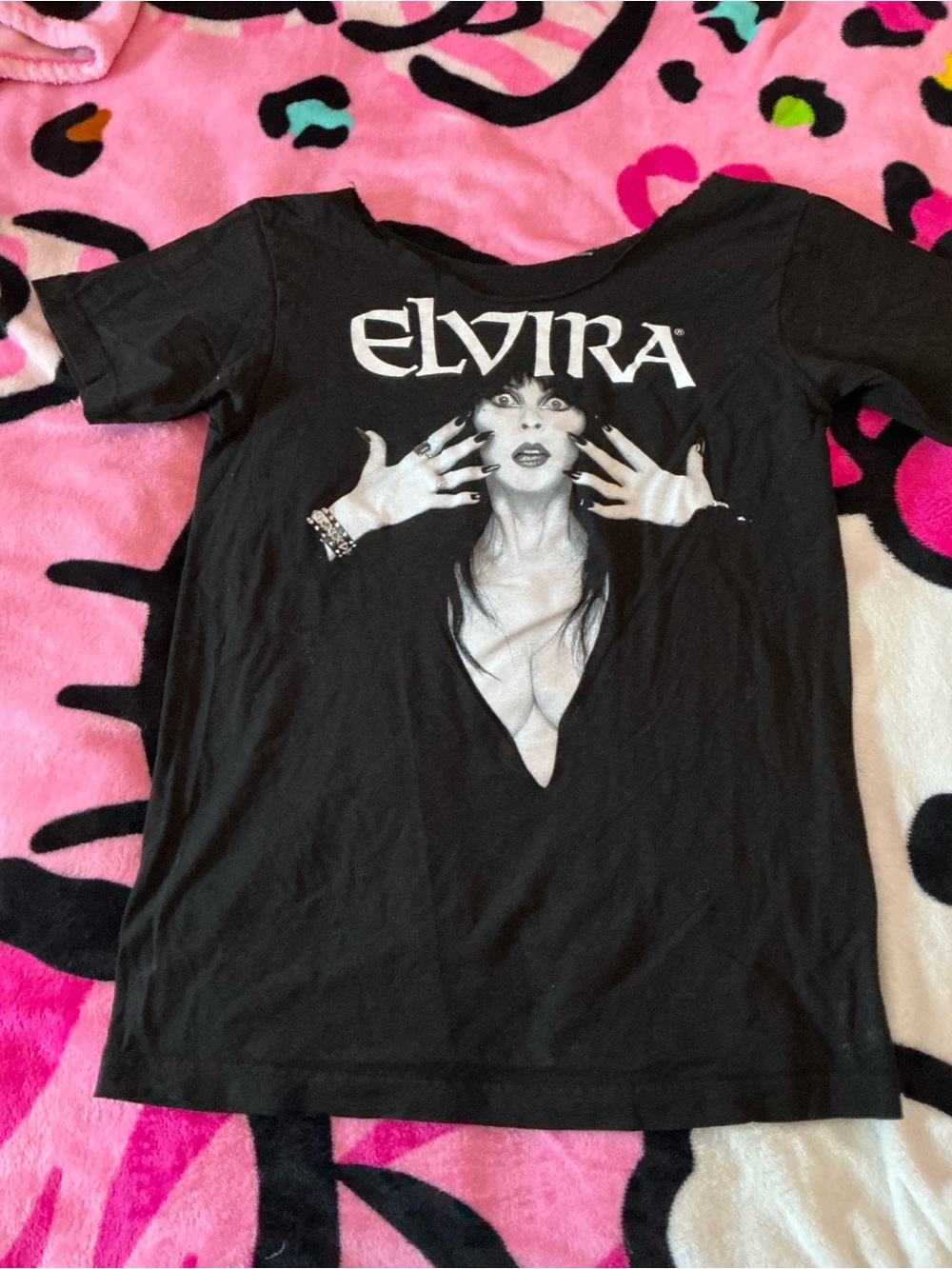 Elvira Black Short Sleeve Graphic Tee cut neck that lays off the shoulder nicely